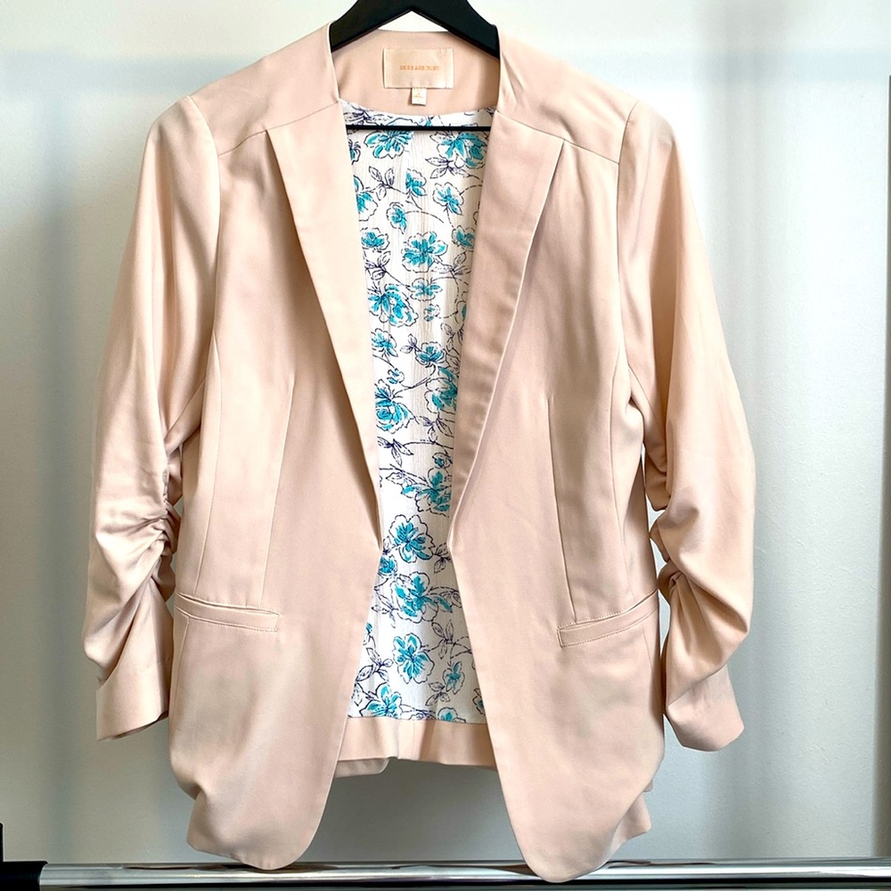 Skies are blue size s women’s blush colored blazer.